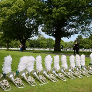Baritone horns and marching band helmets at the Brittany American Cemetery in Normandy, France.
