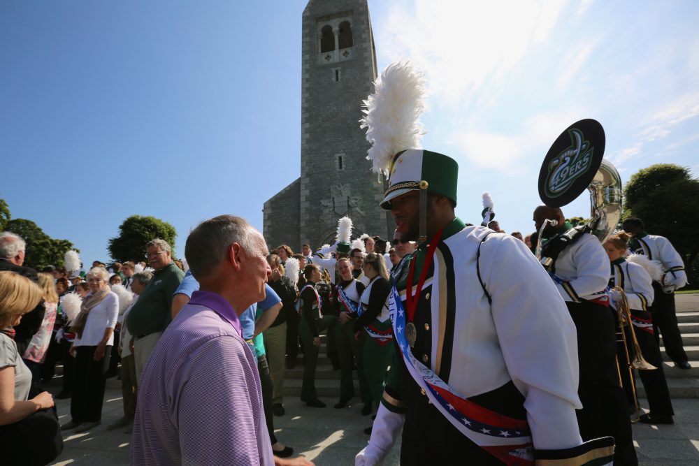 UNC Charlotte marching band member Tyriq Evans, of Winston-Salem, meets with UNC Charlotte Chancellor Phil Dubois shortly after Evans addressed an audience gathered at the Brittany American Cemetery in Normandy, France, to commemorate D-Day and the Allied invasion that retook Europe from Nazi Germany control in 1944.